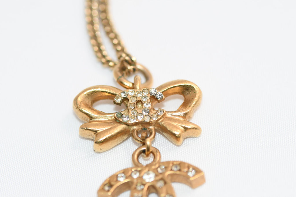 CHANEL Pendant Necklace Gold ribbon CC Logo silver rhinestone 06A