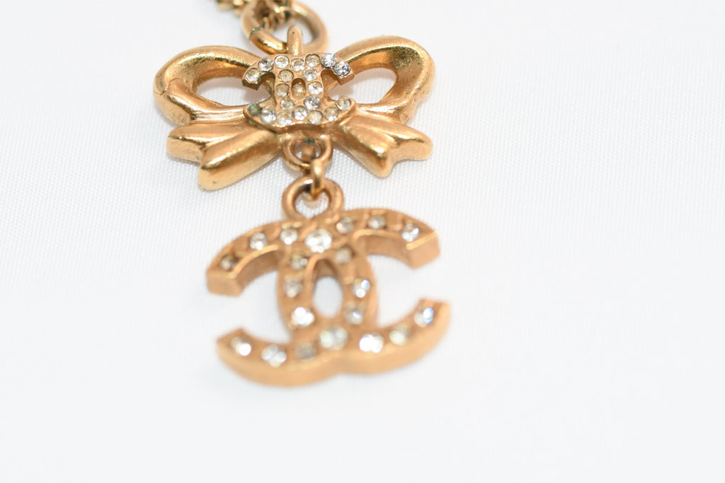 CHANEL Pendant Necklace Gold ribbon CC Logo silver rhinestone 06A