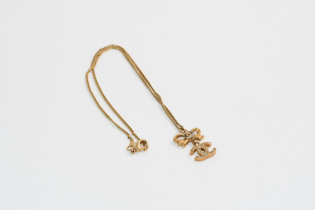 CHANEL Pendant Necklace Gold ribbon CC Logo silver rhinestone 06A