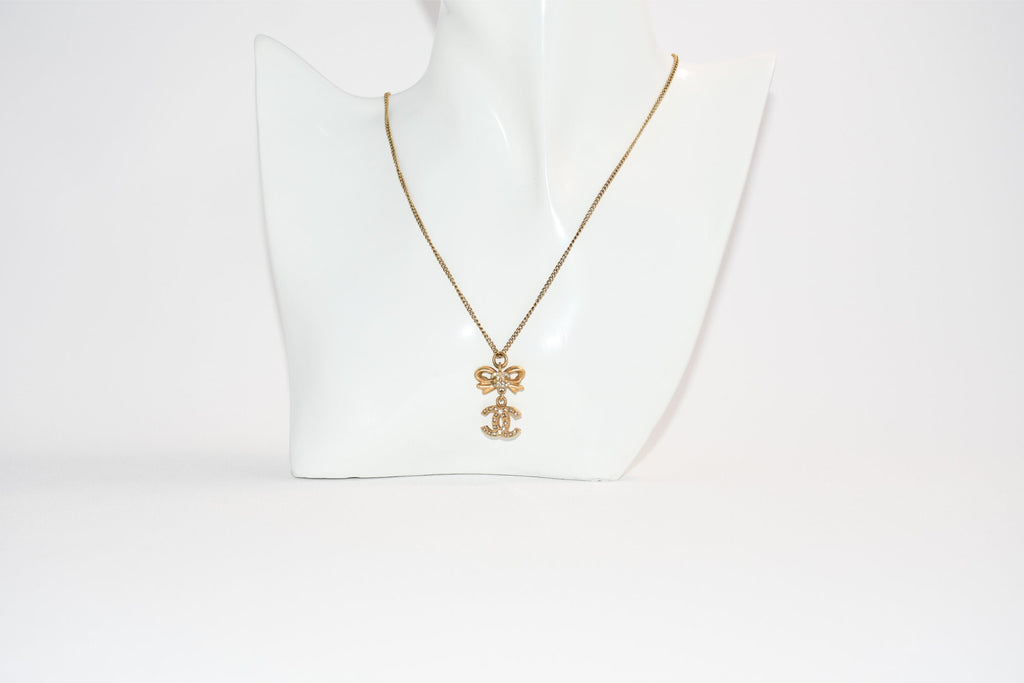 CHANEL Pendant Necklace Gold ribbon CC Logo silver rhinestone 06A