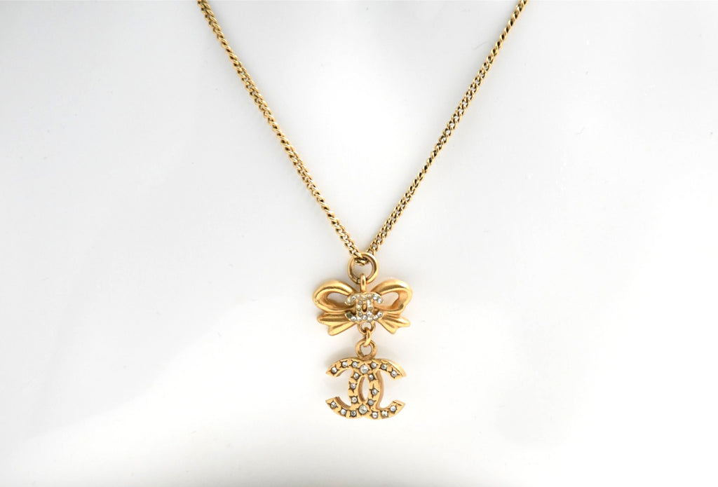 CHANEL Pendant Necklace Gold ribbon CC Logo silver rhinestone 06A