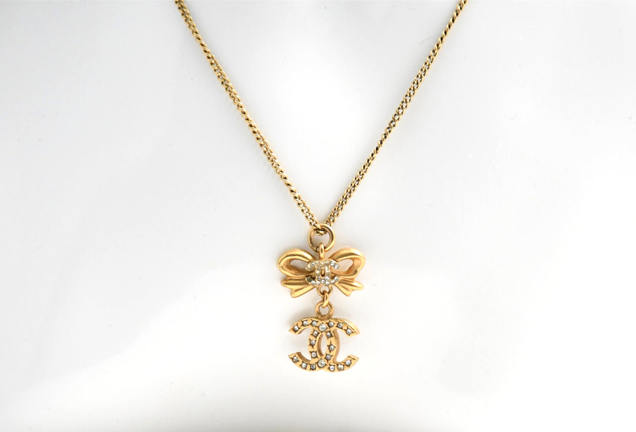 CHANEL Pendant Necklace Gold ribbon CC Logo silver rhinestone 06A