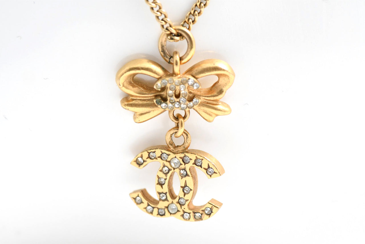CHANEL Pendant Necklace Gold ribbon CC Logo silver rhinestone 06A