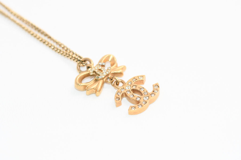 CHANEL Pendant Necklace Gold ribbon CC Logo silver rhinestone 06A