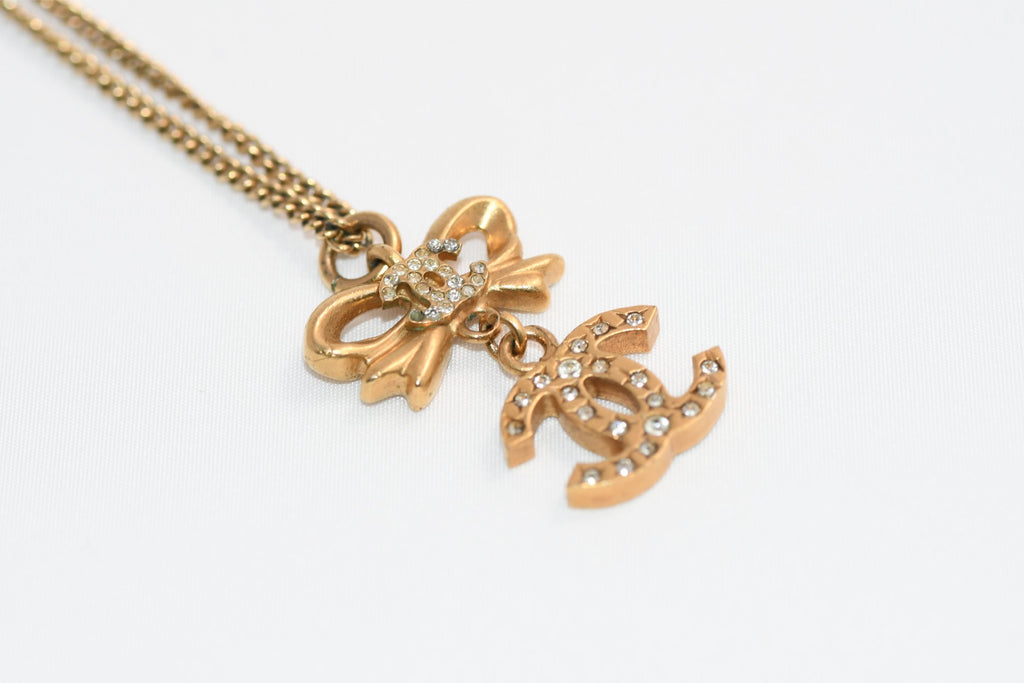 CHANEL Pendant Necklace Gold ribbon CC Logo silver rhinestone 06A