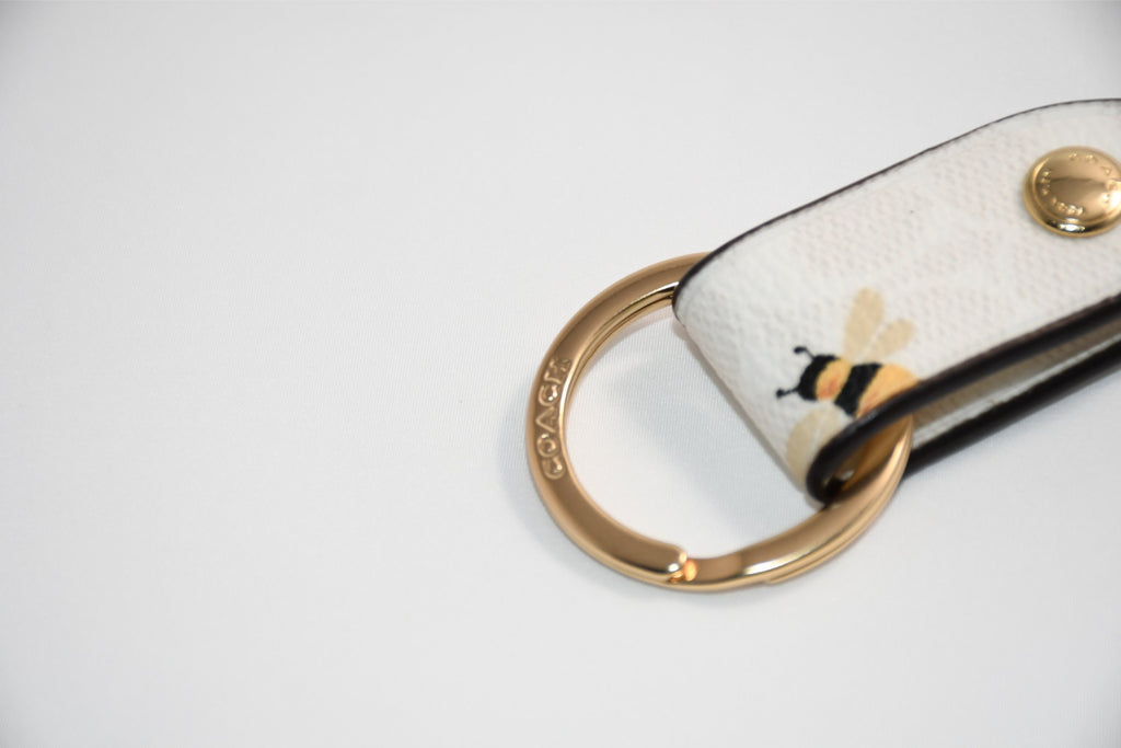 Coach Trigger Snap Bag Charm In Signature Canvas Honey Bee Print keychain
