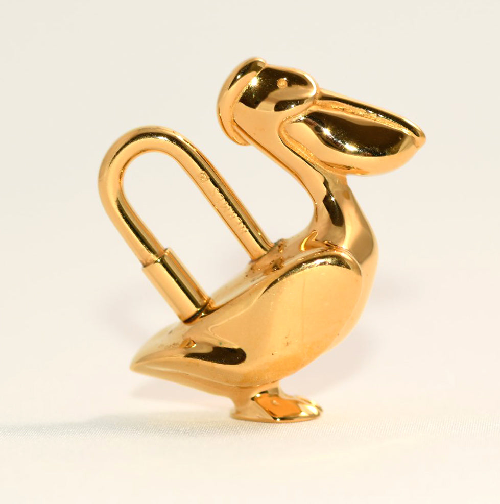 Hermes Cadena Pelican Gold motif bag charm lock 1992
