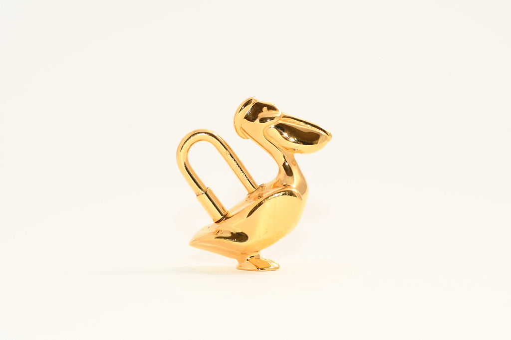 Hermes Cadena Pelican Gold motif bag charm lock 1992