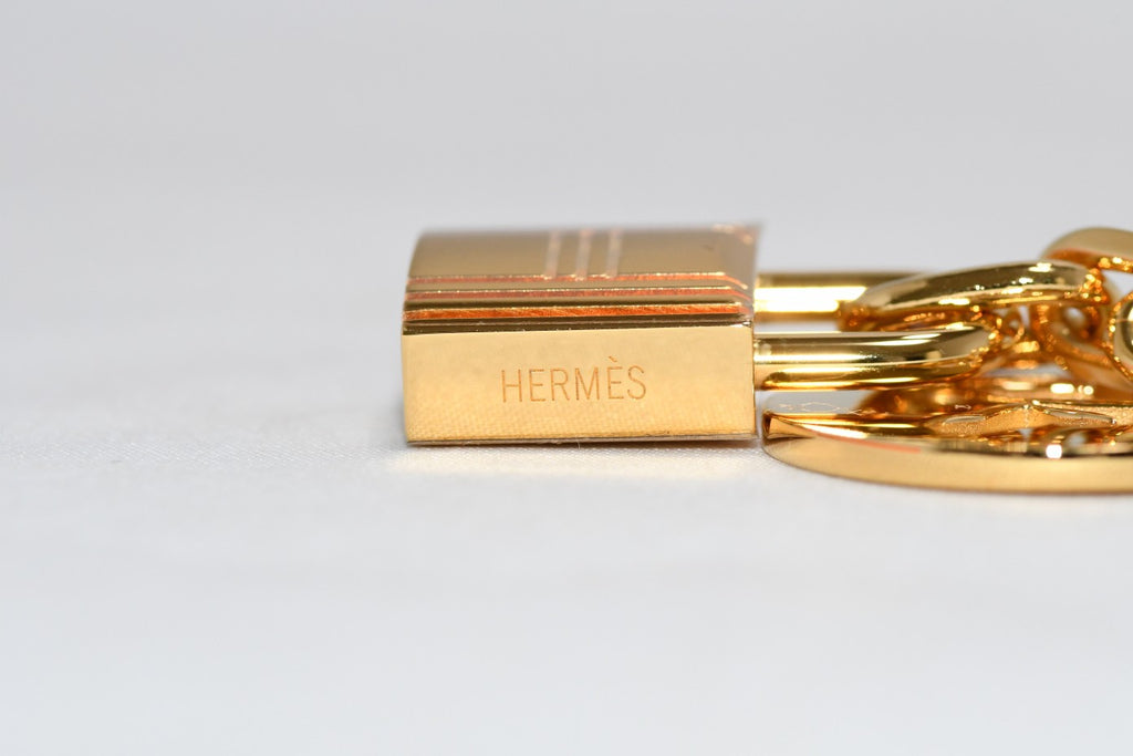 Hermes Gold Breloque Olga bag charm amulette Cadena berloque Excellent - MINT