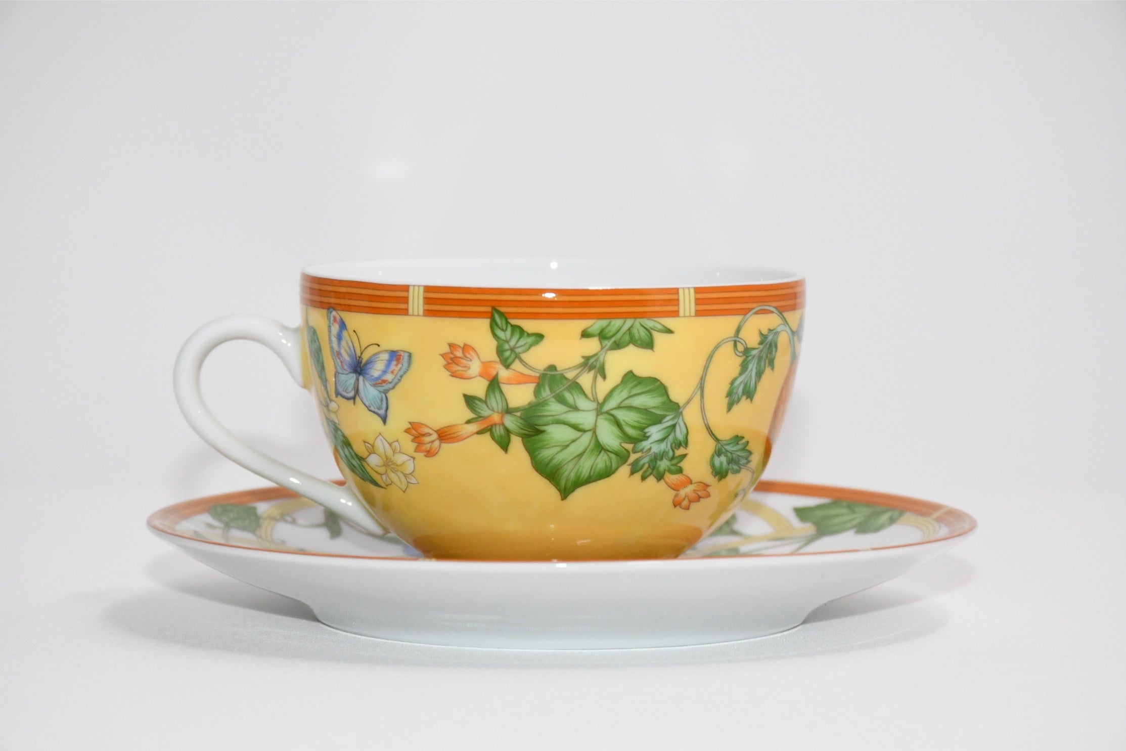 Hermes La Siesta Tea Cup and Saucer Set of 2 yellow porcelain