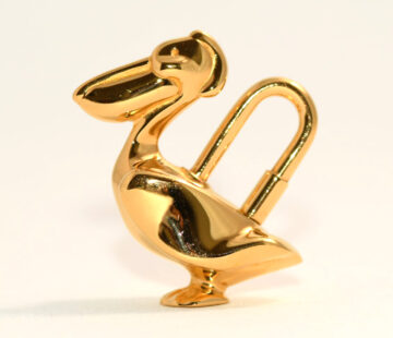 Hermes Cadena Pelican Gold motif bag charm lock 1992